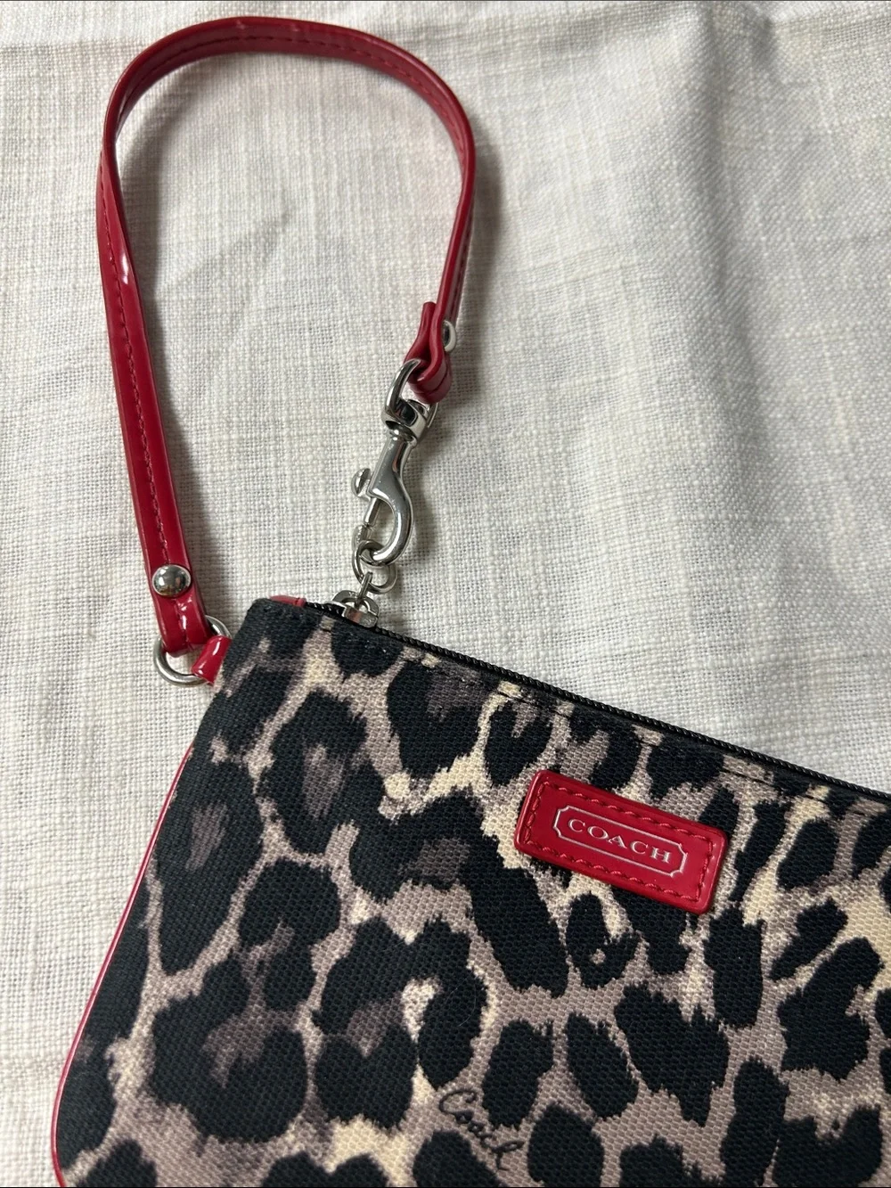 Coach wristlet featuring